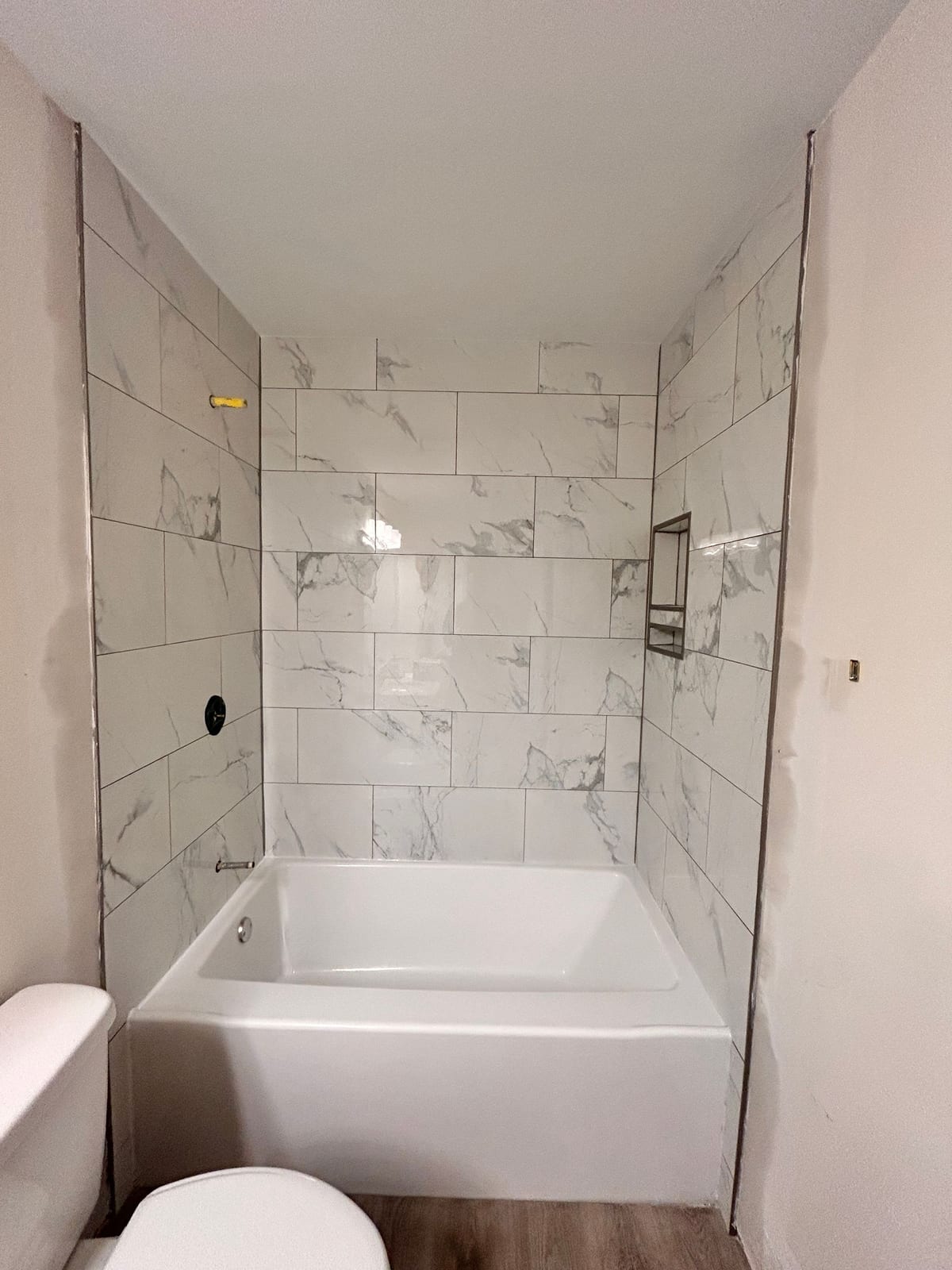 New tub and surround installed